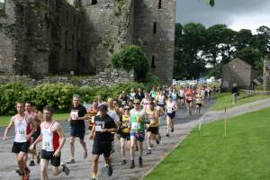 Runners passing Bolton Castle